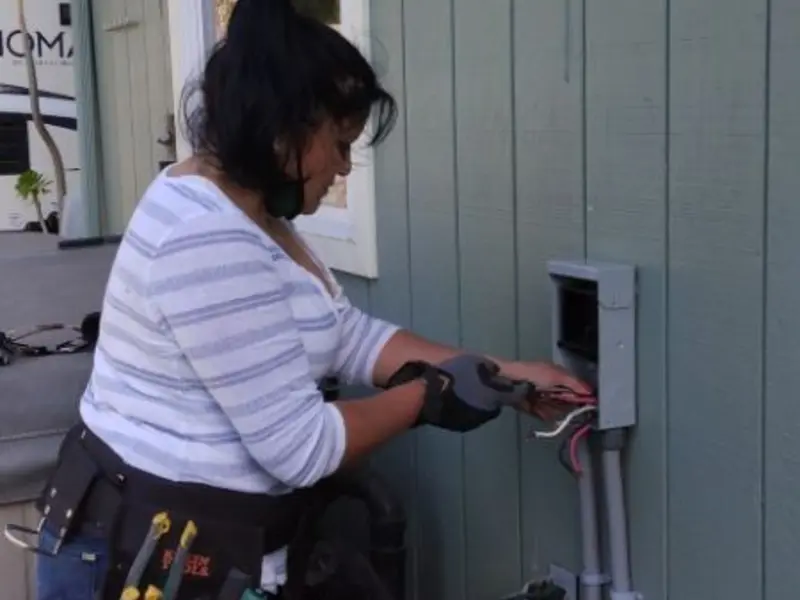 Licensed electrician wiring an exterior subpanel in American Canyon